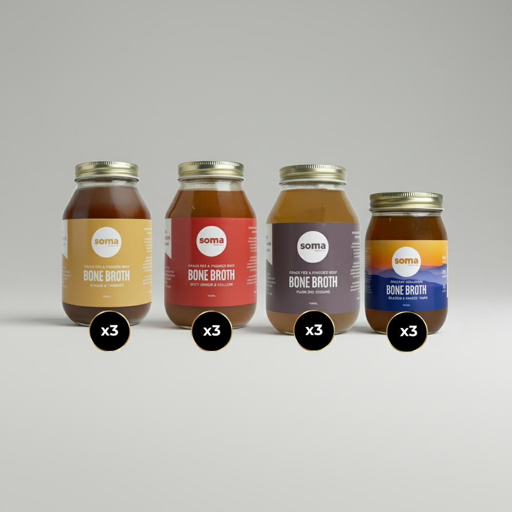 Four jars of Soma Bone Broth in different flavors on a white background